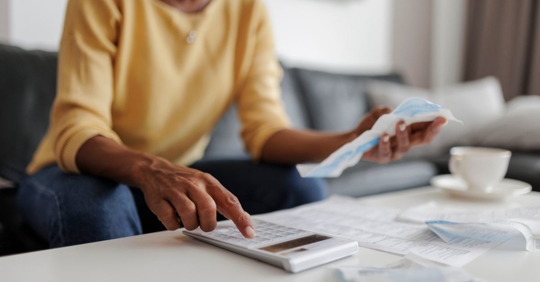 Woman calculating her income