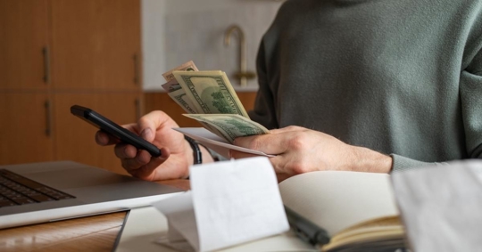 Person checking income and savings