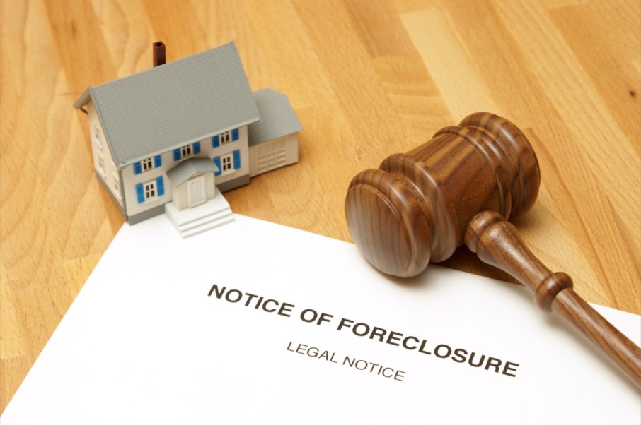Foreclosure Document with Toy House and Gavel